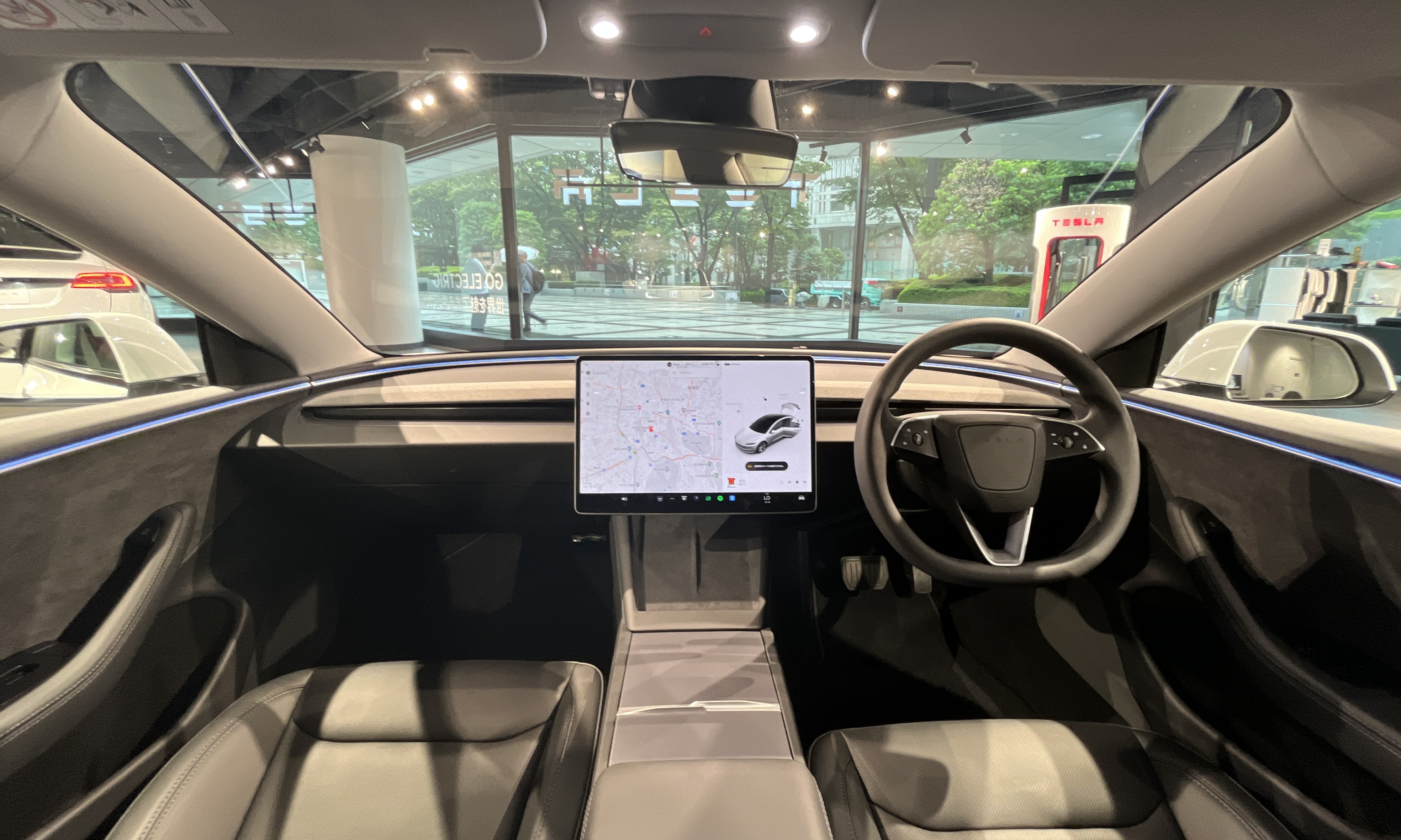 Interior of a prior Tesla Model 3 Long Range, shown as a cabin illustration